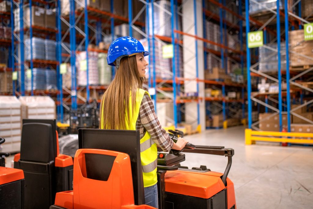warehouse-worker-protective-work-wear-driving-forklift-manipulating-goods-storage-facility